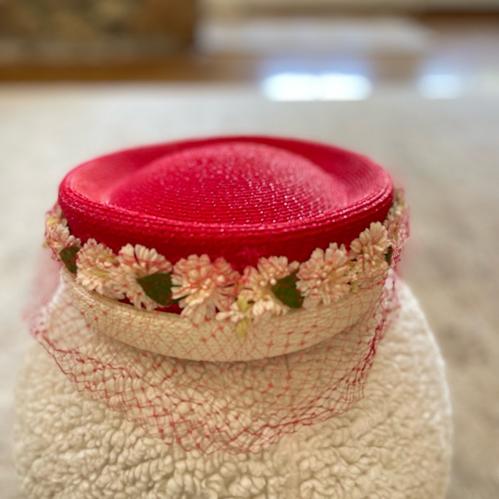 1950s red and white vintage hat with dainty flowers and face netting.